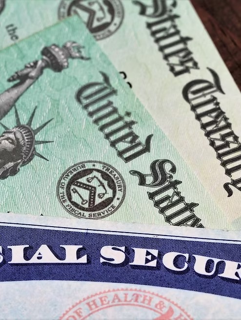 Social Security card with United States Treasury benefit checks